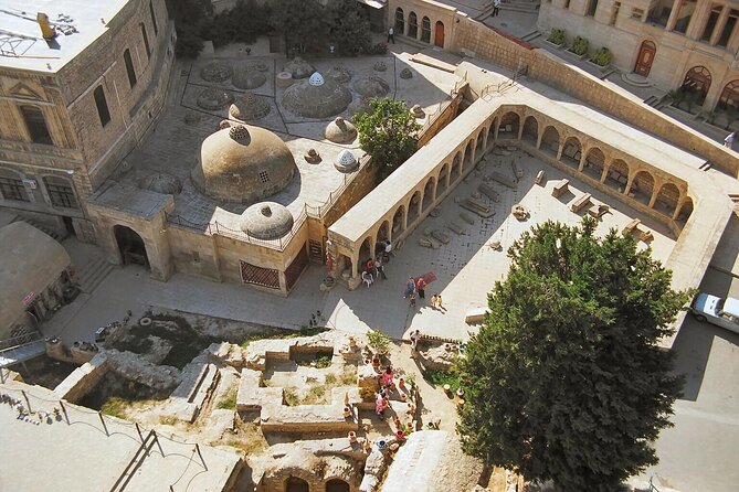 Group Walking Tour in Baku Old City - Fortress walls and defensive towers: why 14th-century stone still matters