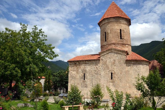Sheki tour with overnight - Church of Kish museum: a round church, a trilingual museum, and even grave viewing